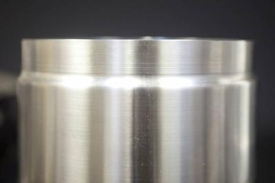 Reduced stainless steel rolled and welded cylinder